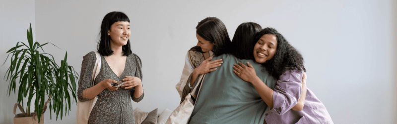 Group Supporting Each Other and Hugging After Therapy