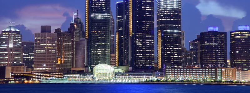 Beautiful Photograph of Detroit City Skyscrapers at Nighttime with Dark Blue Sky