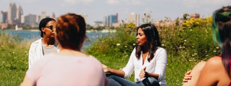 Picture of Nishani Jayawardena Providing Group Therapy Services As She Talks to the City of Detroit